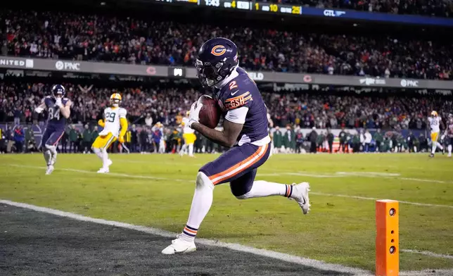 Chicago Bears' DJ Moore catches a touchdown pass during the second half of an NFL wild-card playoff football game against the Green Bay Packers Saturday, Jan. 10, 2026, in Chicago. (AP Photo/Nam Huh)