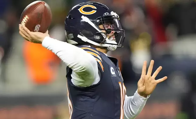 Chicago Bears' Caleb Williams throws during the second half of an NFL wild-card playoff football game against the Green Bay Packers Saturday, Jan. 10, 2026, in Chicago. (AP Photo/Nam Huh)
