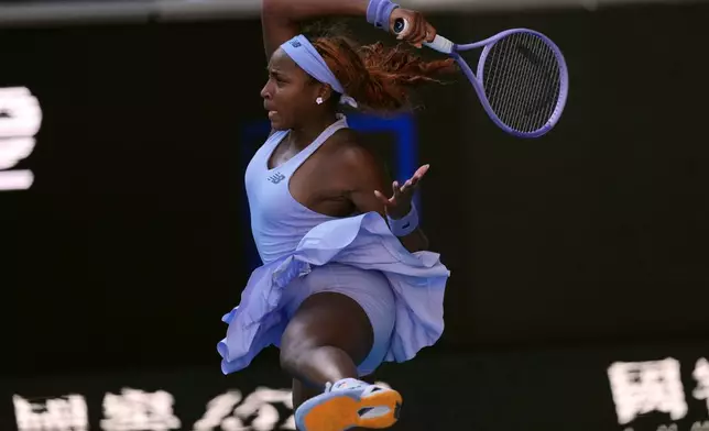 Coco Gauff of the U.S. plays a forehand return to Karolina Muchova of the Czech Republic during their fourth round match at the Australian Open tennis championship in Melbourne, Australia, Sunday, Jan. 25, 2026. (AP Photo/Asanka Brendon Ratnayake)