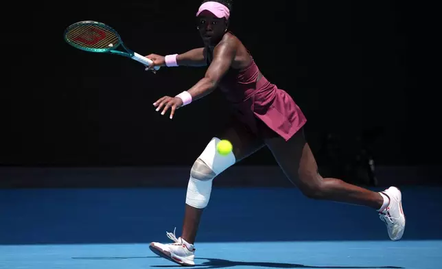 Victoria Mboko of Canada plays a forehand return to Aryna Sabalenka of Belarus during their fourth round match at the Australian Open tennis championship in Melbourne, Australia, Sunday, Jan. 25, 2026. (AP Photo/Dita Alangkara)