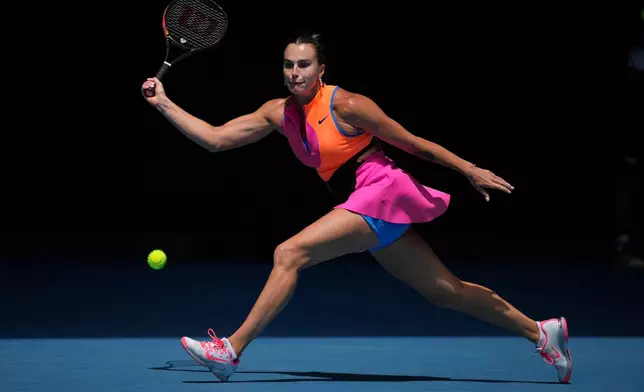Aryna Sabalenka of Belarus plays a forehand return to Victoria Mboko of Canada during their fourth round match at the Australian Open tennis championship in Melbourne, Australia, Sunday, Jan. 25, 2026. (AP Photo/Dita Alangkara)