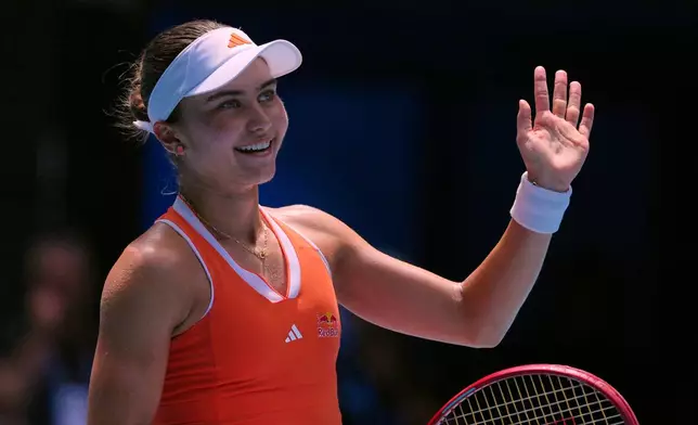Iva Jovic of the U.S. celebrates after defeating Yulia Putintseva of Kazakhstan in their fourth round match at the Australian Open tennis championship in Melbourne, Australia, Sunday, Jan. 25, 2026. (AP Photo/Aaron Favila)