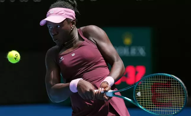Victoria Mboko of Canada plays a backhand return to Aryna Sabalenka of Belarus during their fourth round match at the Australian Open tennis championship in Melbourne, Australia, Sunday, Jan. 25, 2026. (AP Photo/Dita Alangkara)