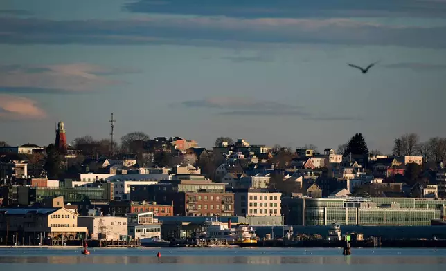 FILE - Buildings on the working waterfront catch the early morning light, Feb. 26, 2025, in Portland, Maine. (AP Photo/Robert F. Bukaty, File)