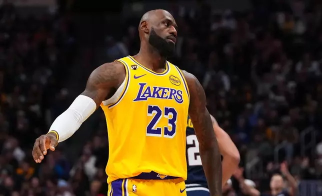 Los Angeles Lakers forward LeBron James (23) reacts to a Denver Nuggets three point basket during the second half of an NBA basketball game Tuesday, Jan. 20, 2026, in Denver. (AP Photo/Jack Dempsey)