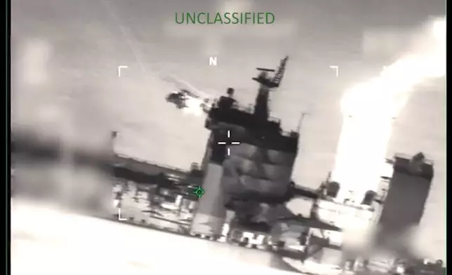 This image from video provided by the U.S. Department of Defense, shows U.S. forces boarding the M/T Sophia in the Caribbean Sea early Wednesday, Jan. 7, 2026. (Department of Defense via AP)