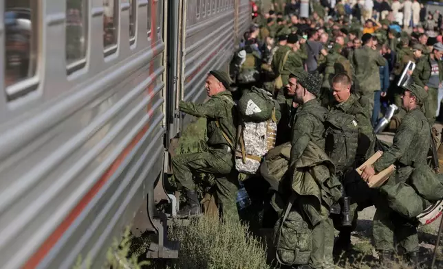 FILE - Russian recruits take a train at a railway station in Prudboi in the Volgograd region of Russia, Sept. 29, 2022. (AP Photo, File)