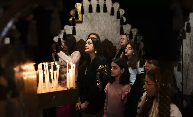 Palestinian Orthodox worshippers attend Christmas Mass at the Orthodox Church of St. Porphyrius in Gaza City Wednesday, Jan. 7, 2026. (AP Photo/Jehad Alshrafi)