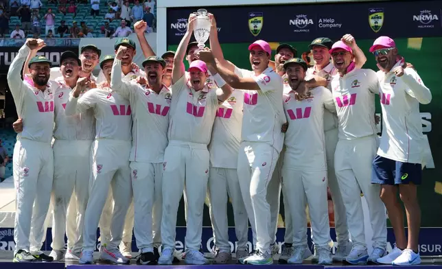 Australian team celebrate with the Ashes trophy following the final Ashes cricket test between England and Australia in Sydney, Australia, Thursday, Jan. 8, 2026. (AP Photo/Mark Baker)