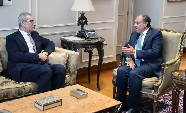 Ali Shaath, head of Palestinian National committee for administering the Gaza Strip, left, meets with Egyptian Foreign Minister Badr Abdelatty, at the foreign ministry headquarters in Egypt's New Administrative Capital, Monday, Jan. 19, 2026. (AP Photo/Khaled Elfiqi)