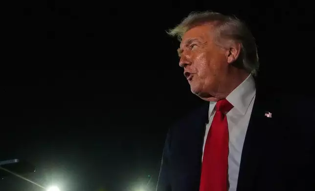 President Donald Trump speaks to reporters before boarding Air Force One at Palm Beach International Airport, Monday, Jan. 19, 2026, in West Palm Beach, Fla. (AP Photo/Julia Demaree Nikhinson)