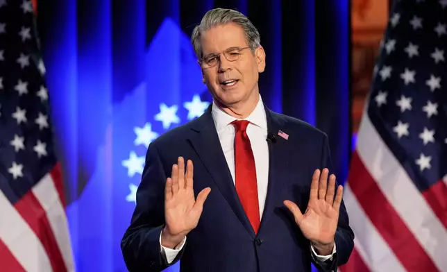 Scott Bessent, US Secretary of the Treasury, holds a speech at the USA House during the Annual Meeting of the World Economic Forum in Davos, Switzerland, Tuesday, Jan. 20, 2026. (AP Photo/Markus Schreiber)
