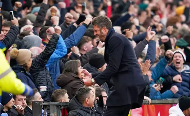 Manchester United's head coach Michael Carrick celebrates during the English Premier League soccer match between Manchester United and Manchester City in Manchester, England, Saturday, Jan. 17, 2026. (AP Photo/Dave Thompson)