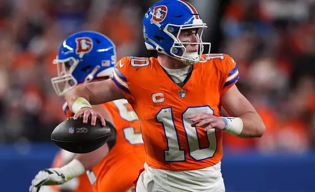 Denver Broncos quarterback Bo Nix (10) passes against the Los Angeles Chargers during the second half of an NFL football game, Sunday, Jan. 4, 2026, in Denver. (AP Photo/David Zalubowski)