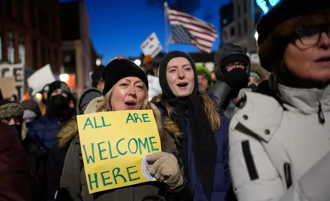 Protesters rally against the presence of U.S. Immigration Customs Enforcement in Maine, Friday, Jan. 23, 2026, in Portland, Maine. (AP Photo/Robert F. Bukaty)