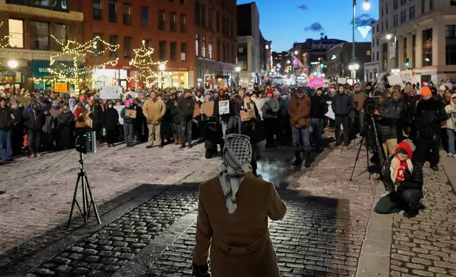 Protesters rally against the presence of U.S. Immigration Customs Enforcement in Maine, Friday, Jan. 23, 2026, in Portland, Maine. (AP Photo/Robert F. Bukaty)