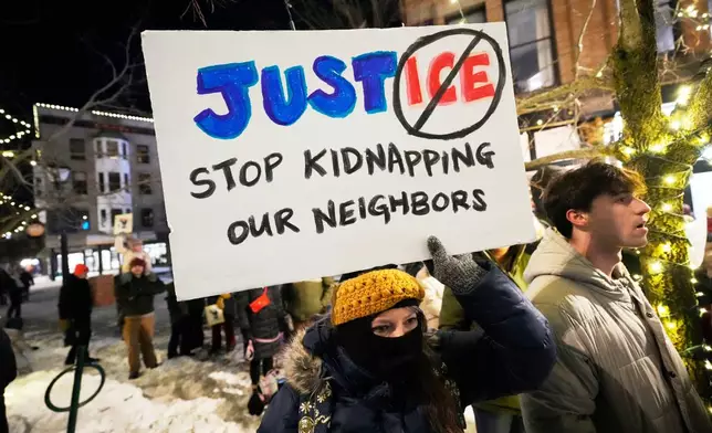 Protesters rally against the presence of U.S. Immigration Customs Enforcement in Maine, Friday, Jan. 23, 2026, in Portland, Maine. (AP Photo/Robert F. Bukaty)