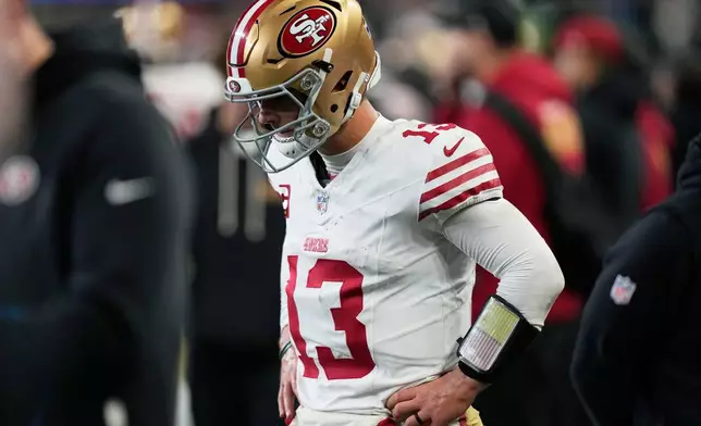 San Francisco 49ers quarterback Brock Purdy reacts after fumbling the ball during the second half of an NFL football divisional playoff game against the Seattle Seahawks, Saturday, Jan. 17, 2026, in Seattle. (AP Photo/Stephen Brashear)