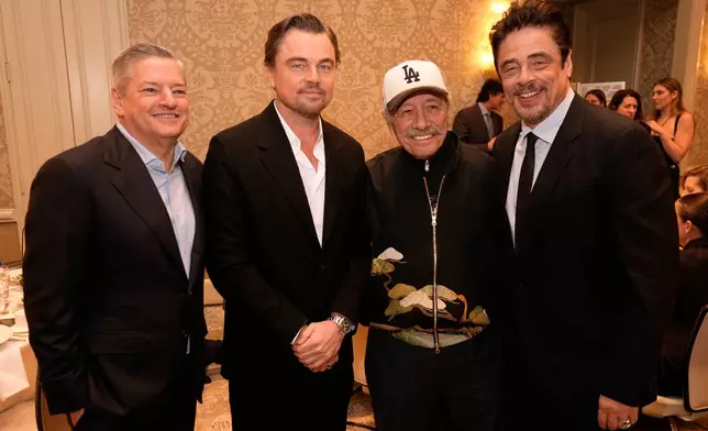 Netflix CEO Ted Sarandos from left, and actors Leonardo DiCaprio, Edward James Olmos and Benicio del Toro pose for a photo at the AFI Awards at the Four Seasons in Los Angeles, Friday, Jan. 9, 2026. (AP Photo/Chris Pizzello)
