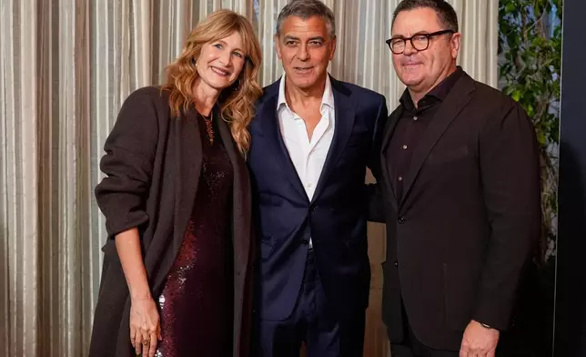 Actors Laura Dern, from left, George Clooney and Nick Offerman pose together at the AFI Awards at the Four Seasons in Los Angeles, Friday, Jan. 9, 2026. (AP Photo/Chris Pizzello)