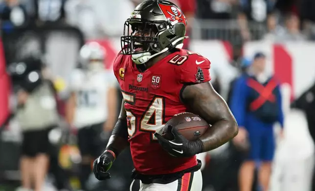 Tampa Bay Buccaneers linebacker Lavonte David (54) celebrates after recovering a fumble by Carolina Panthers running back Rico Dowdle during the second half of an NFL football game Saturday, Jan. 3, 2026, in Tampa, Fla. (AP Photo/Jason Behnken)