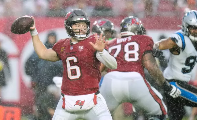 Tampa Bay Buccaneers quarterback Baker Mayfield (6) throws a pass during the first half of an NFL football game against the Carolina Panthers Saturday, Jan. 3, 2026, in Tampa, Fla. (AP Photo/Chris O'Meara)