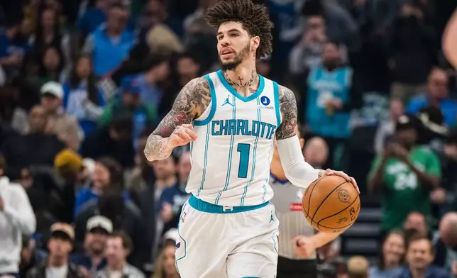 Charlotte Hornets guard LaMelo Ball dribbles the ball during an NBA basketball game against the Dallas Mavericks, Thursday, Jan. 29, 2026, in Dallas. (AP Photo/Jessica Tobias)