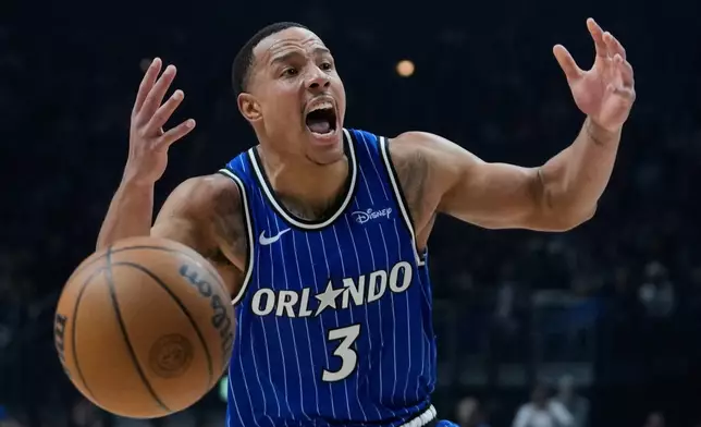 Orlando Magic guard Desmond Bane (3) reacts during an NBA basketball game between Orlando Magic and Memphis Grizzlies in Berlin, Germany, Thursday, Jan. 15, 2026. (AP Photo/Ebrahim Noroozi)