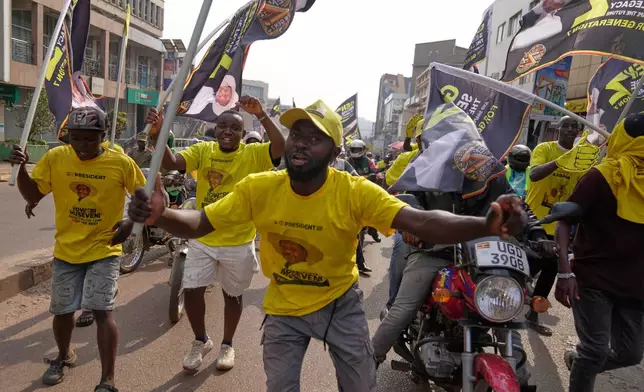Supporters of Ugandan President Yoweri Museveni celebrate his victory in the presidential election in Kampala, Uganda, Saturday, Jan. 17, 2026. (AP Photo/Brian Inganga)