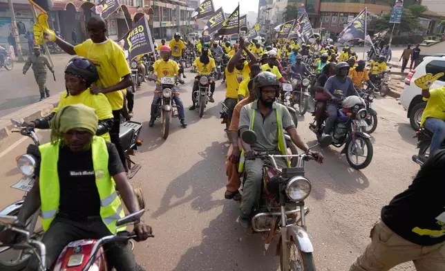 Supporters of Ugandan President Yoweri Museveni celebrate his victory in the presidential election in Kampala, Uganda, Saturday, Jan. 17, 2026. (AP Photo/Brian Inganga)