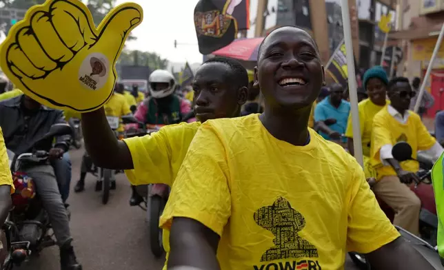 Supporters of Ugandan President Yoweri Museveni celebrate his victory in the presidential election in Kampala, Uganda, Saturday, Jan. 17, 2026. (AP Photo/Brian Inganga)