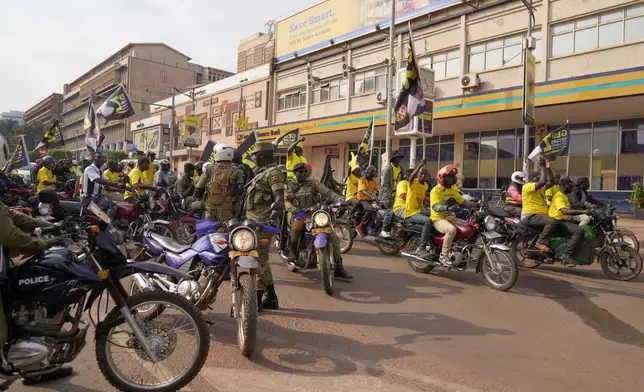 Uganda's security forces patrol a street as supporters of Ugandan President Yoweri Museveni celebrate his victory in the presidential election in Kampala, Uganda, Saturday, Jan. 17, 2026. (AP Photo/Brian Inganga)