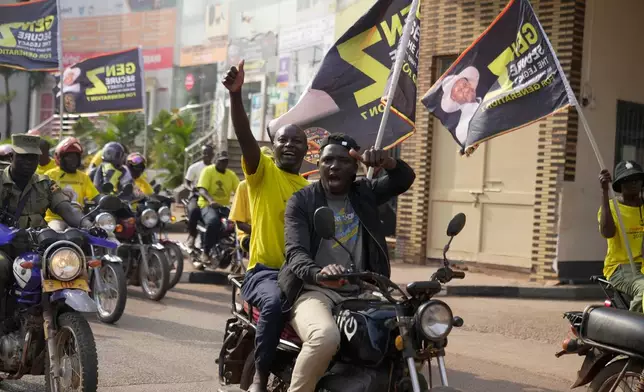 Supporters of Ugandan President Yoweri Museveni celebrate his victory in the presidential election in Kampala, Uganda, Saturday, Jan. 17, 2026. (AP Photo/Brian Inganga)