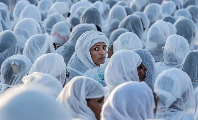 FILE - Worshippers gather on the eve of the Ethiopian Orthodox Christmas, hosted by the Ethiopian Jandereba Generation, at Meskel Square in Addis Ababa, Ethiopia, Tuesday, Jan. 6, 2026. (AP Photo/Amanuel Sileshi, File)