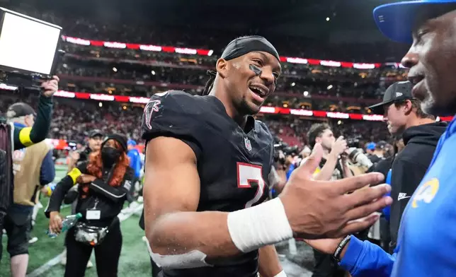 Atlanta Falcons running back Bijan Robinson (7) celebrates after an NFL football game against the Los Angeles Rams, Monday, Dec. 29, 2025, in Atlanta. (AP Photo/Brynn Anderson)