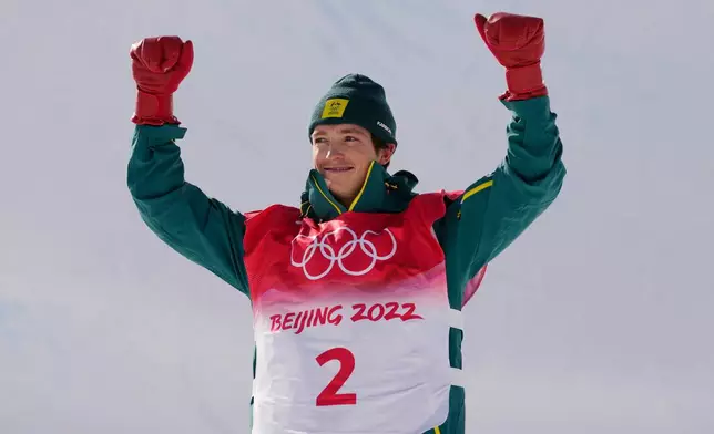 FILE - Silver medal winner Australia's Scotty James celebrates during the venue award ceremony for the men's halfpipe finals at the 2022 Winter Olympics, Feb. 11, 2022, in Zhangjiakou, China. (AP Photo/Francisco Seco, File)
