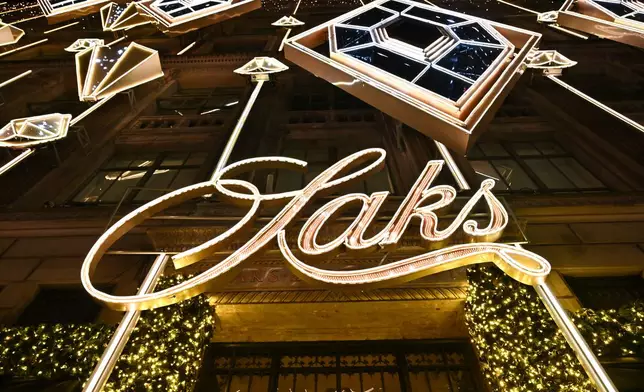 FILE - Saks Fifth Avenue holiday light show and window reveal on Monday, Nov. 24, 2025, in New York. (Photo by Evan Agostini/Invision/AP, File)