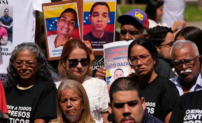 Relatives of political prisoners gather at the Central University of Venezuela to call for their release in Caracas, Venezuela, Tuesday, Jan. 13, 2026. (AP Photo/Matias Delacroix)
