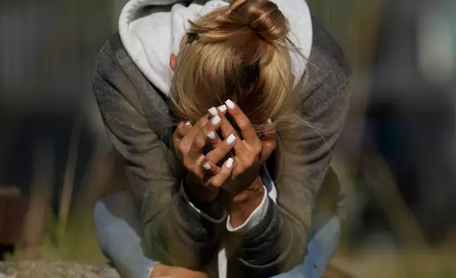 Jacklin Ibarreto, whose father Miguel Ibarreto is detained, waits outside the Rodeo I prison in Guatire, Venezuela, Friday, Jan. 9, 2026, after National Assembly President Jorge Rodriguez said the government would release Venezuelan and foreign prisoners. (AP Photo/Matias Delacroix)
