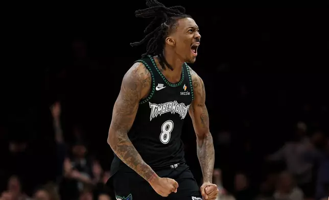 Minnesota Timberwolves guard Bones Hyland (8) celebrates his 3-point basket against the Oklahoma City Thunder during the first half of an NBA basketball game, Thursday, Jan. 29, 2026, in Minneapolis. (AP Photo/Matt Krohn)