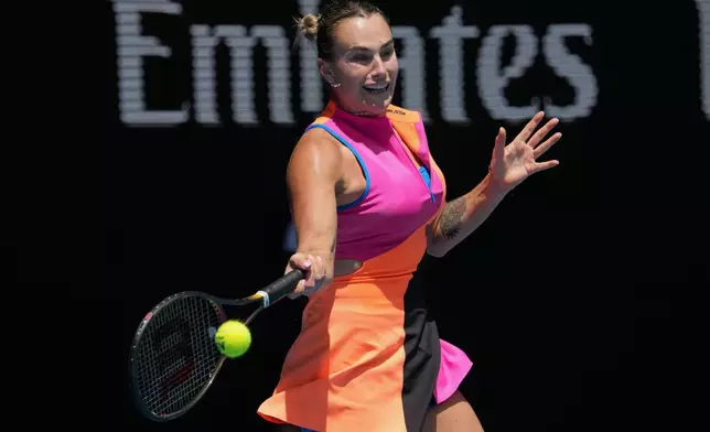 Aryna Sabalenka of Belarus plays a forehand return to Bai Zhuoxuan of China during their second round match at the Australian Open tennis championship in Melbourne, Australia, Wednesday, Jan. 21, 2026. (AP Photo/Dita Alangkara)