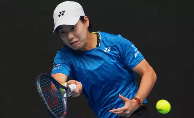 Bai Zhuoxuan of China plays a forehand return to Aryna Sabalenka of Belarus during their second round match at the Australian Open tennis championship in Melbourne, Australia, Wednesday, Jan. 21, 2026. (AP Photo/Dita Alangkara)