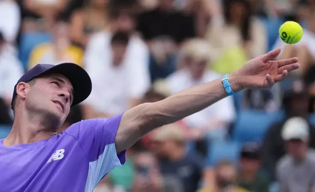 Tommy Paul of the U.S. serves to Thiago Agustin Tirante of Argentina during their second round match at the Australian Open tennis championship in Melbourne, Australia, Wednesday, Jan. 21, 2026. (AP Photo/Asanka Brendon Ratnayake)