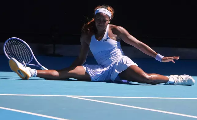 Coco Gauff of the U.S. falls during her second round match against Olga Danilovic of Serbia at the Australian Open tennis championship in Melbourne, Australia, Wednesday, Jan. 21, 2026. (AP Photo/Asanka Brendon Ratnayake)