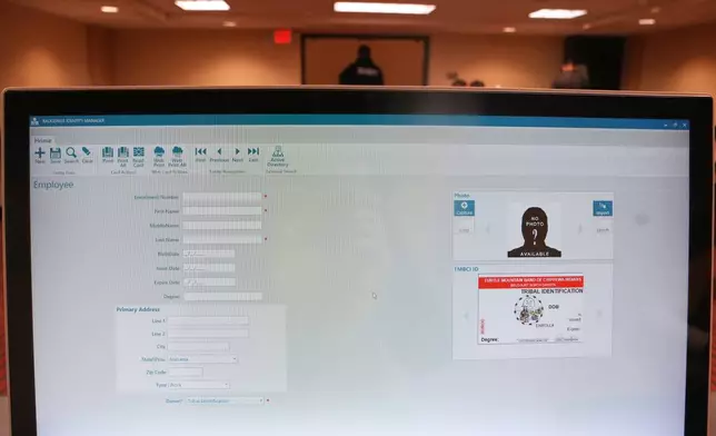 A template of a tribal identification card is displayed on a computer Friday, Jan. 23, 2026, in Minneapolis. (AP Photo/Abbie Parr)