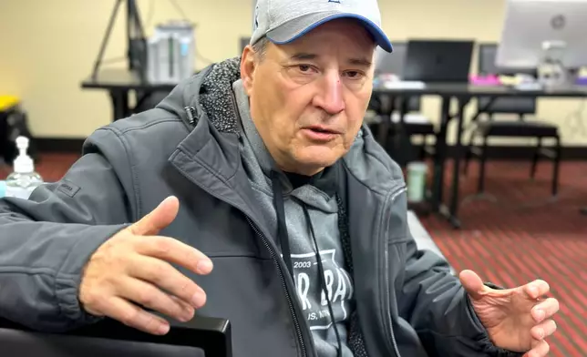 Faron Houle, a citizen of the Turtle Mountain Band of Chippewa, speaks about applying for a tribal identification card at a pop-up event in Minneapolis on Friday, Jan. 23, 2026. (Stewart Huntington/ICT via AP)