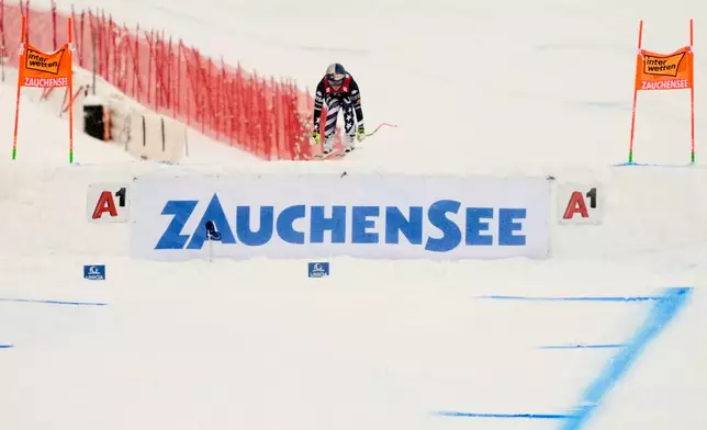 United States' Lindsey Vonn is airborne as he speeds down the course during an alpine ski, women's World Cup downhill, in Zauchensee, Austria, Saturday, Jan. 10, 2026. (AP Photo/Giovanni Auletta)
