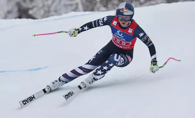 United States' Lindsey Vonn speeds down the course during an alpine ski, women's World Cup downhill, in Zauchensee, Austria, Saturday, Jan. 10, 2026. (AP Photo/Marco Trovati)