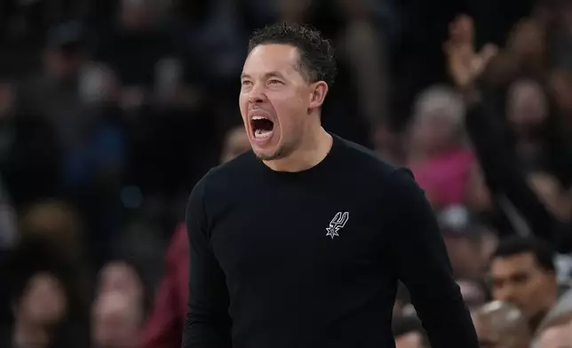 San Antonio Spurs head coach Mitch Johnson calls to his players during the first half of an NBA basketball game against the Portland Trail Blazers in San Antonio, Saturday, Jan. 3, 2026. (AP Photo/Eric Gay)