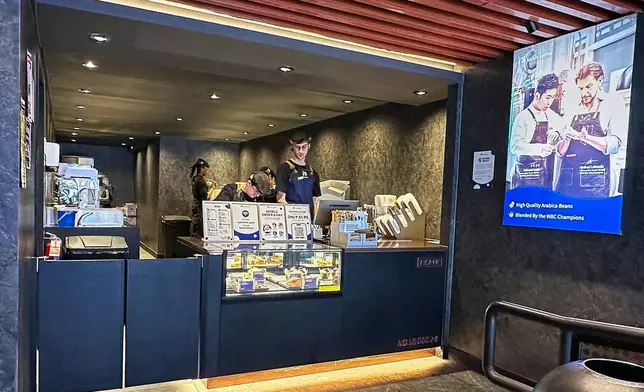 Employees work in a Luckin Coffee store in New York, Friday, Jan. 30, 2026. (AP Photo/Richard Drew)